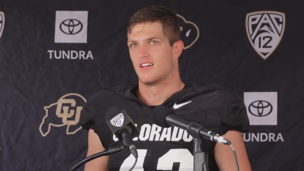 Trevor Woods at the Podium at CU
